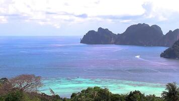 Beautiful famous beach lagoon panorama view between limestone rocks turquoise water on the viewpoint on Koh Phi Phi Don island in Ao Nang Krabi Thailand. video