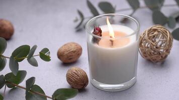 Aromatic candle on the table.  Soy candles  in a jar. Aromatherapy and relax in spa and home. Still life. video