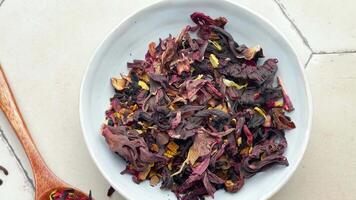 Bowl with dry hibiscus tea video