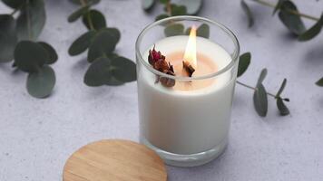 Aromatic candle on the table.  Soy candles  in a jar. Aromatherapy and relax in spa and home. Still life. video