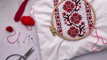 Embroidery with colored threads and various sewing accessories video