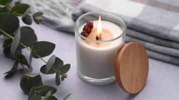 Aromatic candle on the table.  Soy candles  in a jar. Aromatherapy and relax in spa and home. Still life. video