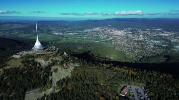Aerial backwards view of TV tower and hotel Jested in Liberec Czechia in October 2023 video