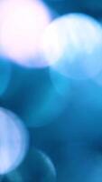 Abstract blurred defocused blue lights with bokeh effect motion background video