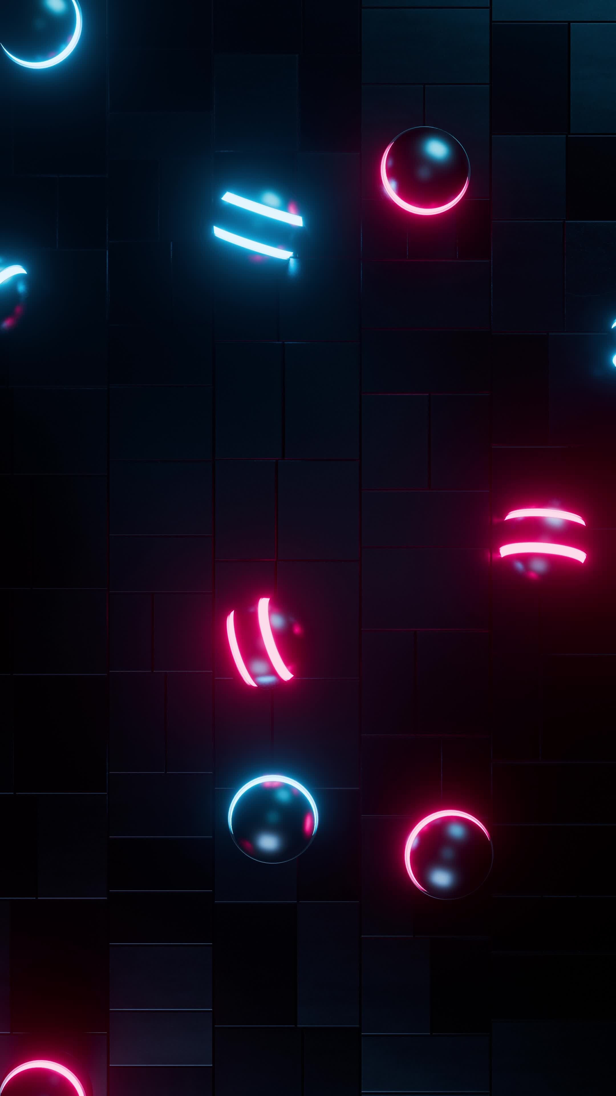 Red and blue neon balls roll across the floor. Vertical looped