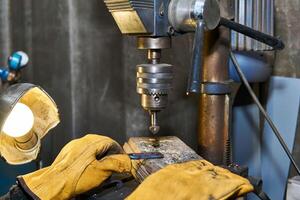 work on a drilling machine with a countersink close-up photo