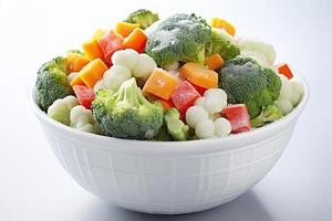 AI generated Frozen vegetables in a white bowl on a white background. Generated by artificial intelligence photo