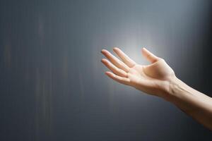 ai generado ligero viene desde un mujer mano en contra el antecedentes de un gris vacío pared. concepto de espiritual vida, apoyo. generado por artificial inteligencia foto