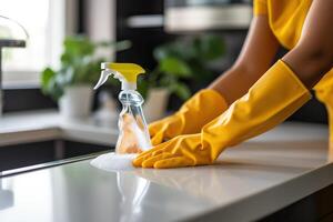 AI generated Hands in yellow household gloves wash the tabletop with a rag. Cleaning concept. Generated by artificial intelligence photo