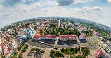 tiny planet in sky with clouds overlooking old town, urban development. Transformation of spherical 360 panorama in abstract aerial view. video