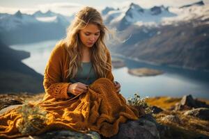 ai generado un niña con fluido pelo con tejido de punto y flores en su manos se sienta alto en el montañas. generado por artificial inteligencia foto