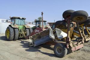 Grader scheduler. A retractor with a grader trailer. photo