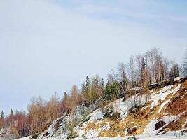 Melting snow in the spring. The spring heat will melt the snow. photo