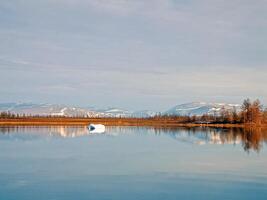 River landscape Early spring. bare trees, melting snow. photo