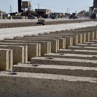 Cinder blocks lie on the ground and dried. on cinder block production plant. photo