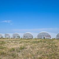 A group of greenhouses for growing tomatoes and cucumbers. photo