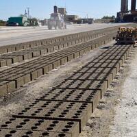 Cinder blocks lie on the ground and dried. on cinder block production plant. photo