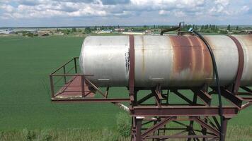 The water tower. An old rustic communal communication. The water tower photo