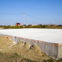 Filled foundation of the house and floors. Home construction. photo