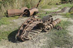 Old caterpillar tract from the combine photo