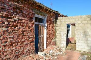 Broken doors in abandoned building photo