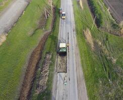 Top view of the road repair. Technics for repair of asphalt. Replacement of asphalt pavement. photo