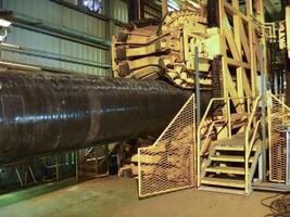 Rolling below the pipeline on convair line for stacking. Preparation and assembly of the underwater gas pipeline to hold the workshop lay barge photo