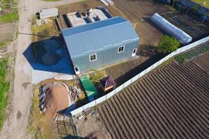 Buildings on the site. Hangar from metal profile, corrugated. Th photo