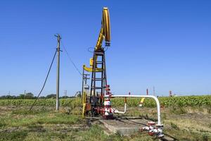 Pumping unit as the oil pump installed on a well photo