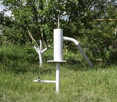 Hand pump leading to an artesian well. photo