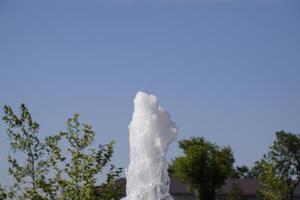 Splashes of a fountain in the park photo