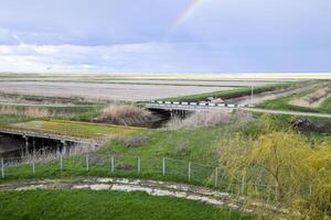 Bridges through irrigation canals. Rice field irrigation system photo