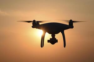 drone silhouette against the background of the sunset photo