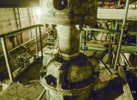 Basement of a water pumping station. Abandoned post-apocalyptic photo