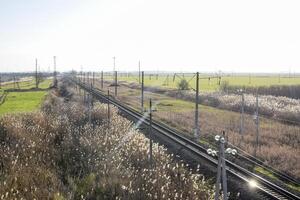 Plot railway. Top view on the rails. High-voltage power lines for electric trains photo