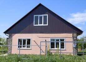 The roof of corrugated sheet on the houses photo