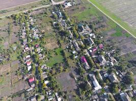 Top view of the village. One can see the roofs of the houses and gardens. Road in the village. Village bird's-eye view photo