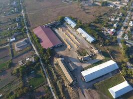 Hangar for storage of grain. A platform for drying and sintering grain. Harvested grain photo