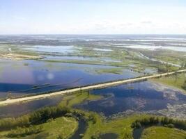 Top view of the oil and gas field. Wetlands and entrances to industrial facilities. photo