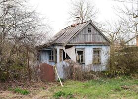 Old abandoned adobe house in the village photo