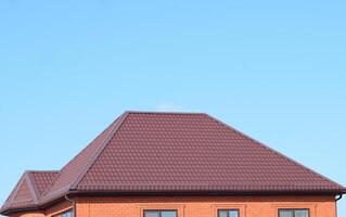 House with a roof made of metal sheets photo