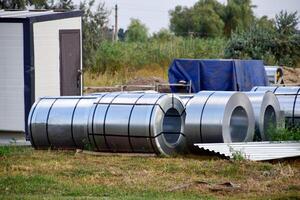 Rolls of sheet metal. Storage of building materials photo