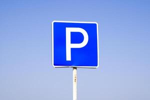 Road sign parking. Sign on a blue sky background. photo