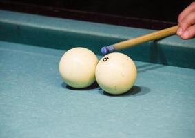 Billiards, billiard table. Targeting the cue in the ball for imp photo