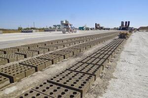 Cinder blocks lie on the ground and dried. on cinder block production plant. photo