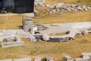 Top view of the excavation site in ruined ancient city of Hierapolis. The remains of destroyed buildings and columns. photo