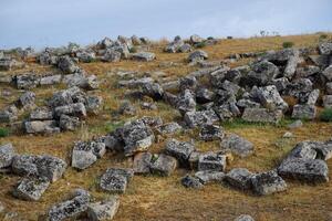 Huge blocks of a wall destroyed by an earthquake. Ruins of the city of Hierapolis photo