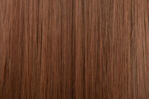 Close up of brown hair as background. Texture of natural hair. photo