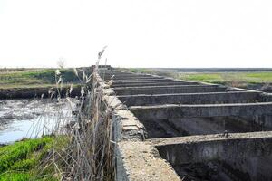 Canal irrigation system rice fields. Concrete tunnel for irrigation canal. photo