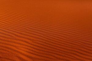 Wadi Rum Desert in Jordan. On the Sunset. Panorama of beautiful sand pattern on the dune. Desert landscape in Jordan. photo